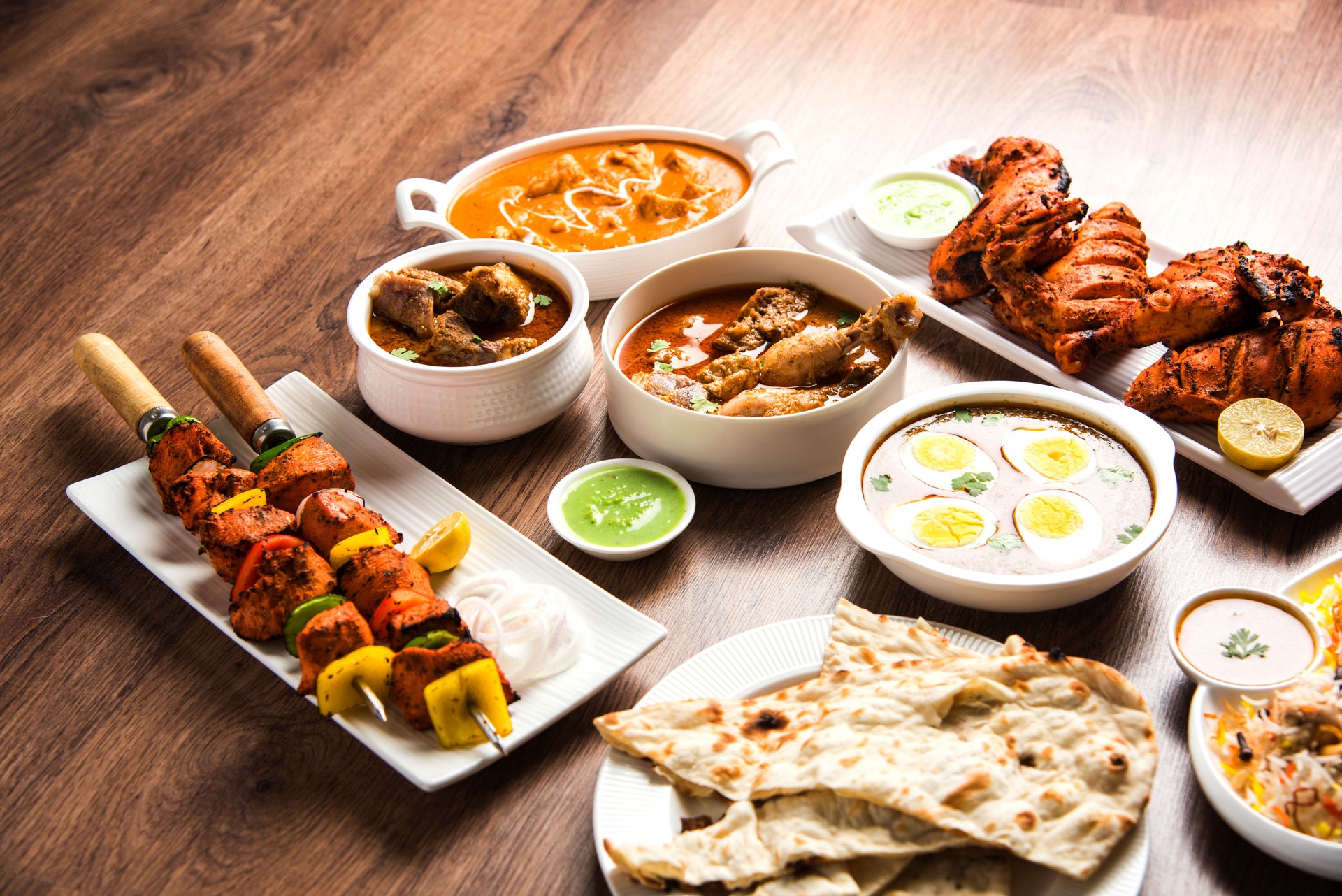 Assorted Indian Non Vegetarian food recipe served in a group. Includes Chicken Curry, Mutton Masala, Anda/egg curry, Butter chicken, biryani, tandoori murg, chicken-tikka and naan/roti